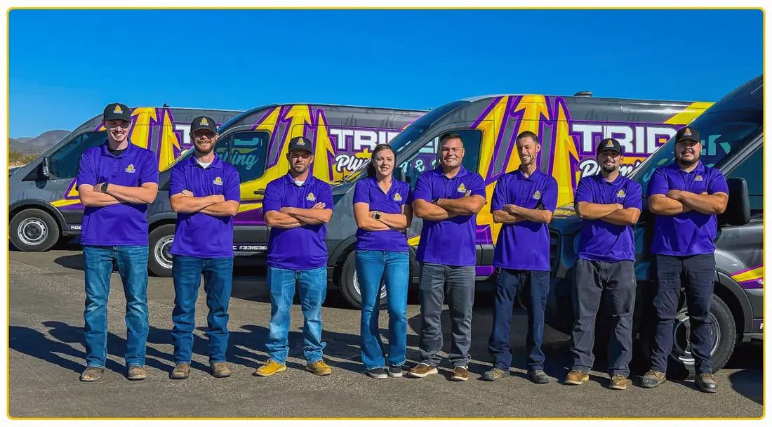 Trident Plumbing & Drain team standing in front of company service vehicles, proudly serving homeowners throughout Phoenix, AZ, with professional plumbing and water heater services.