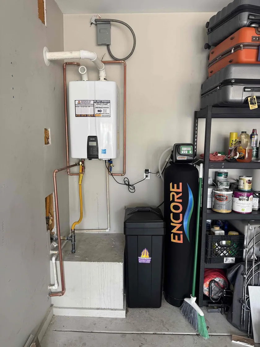 Tankless water heater professionally installed with a whole-home water softener to improve efficiency and reduce mineral buildup.