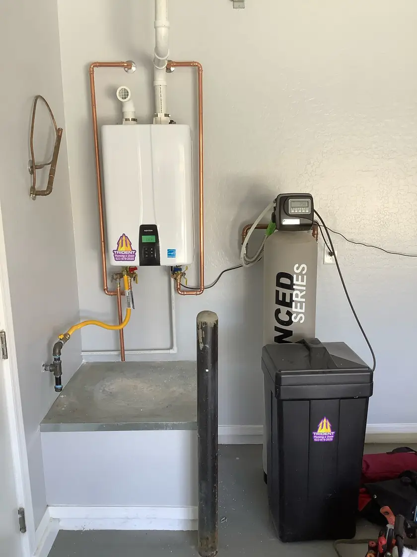 Tankless water heater installed with a whole-home water softener to reduce hard water buildup in Arizona.
