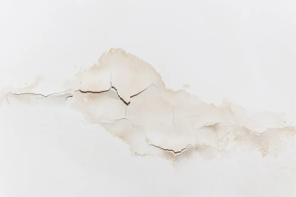 slab leak stains on concrete walls and floors