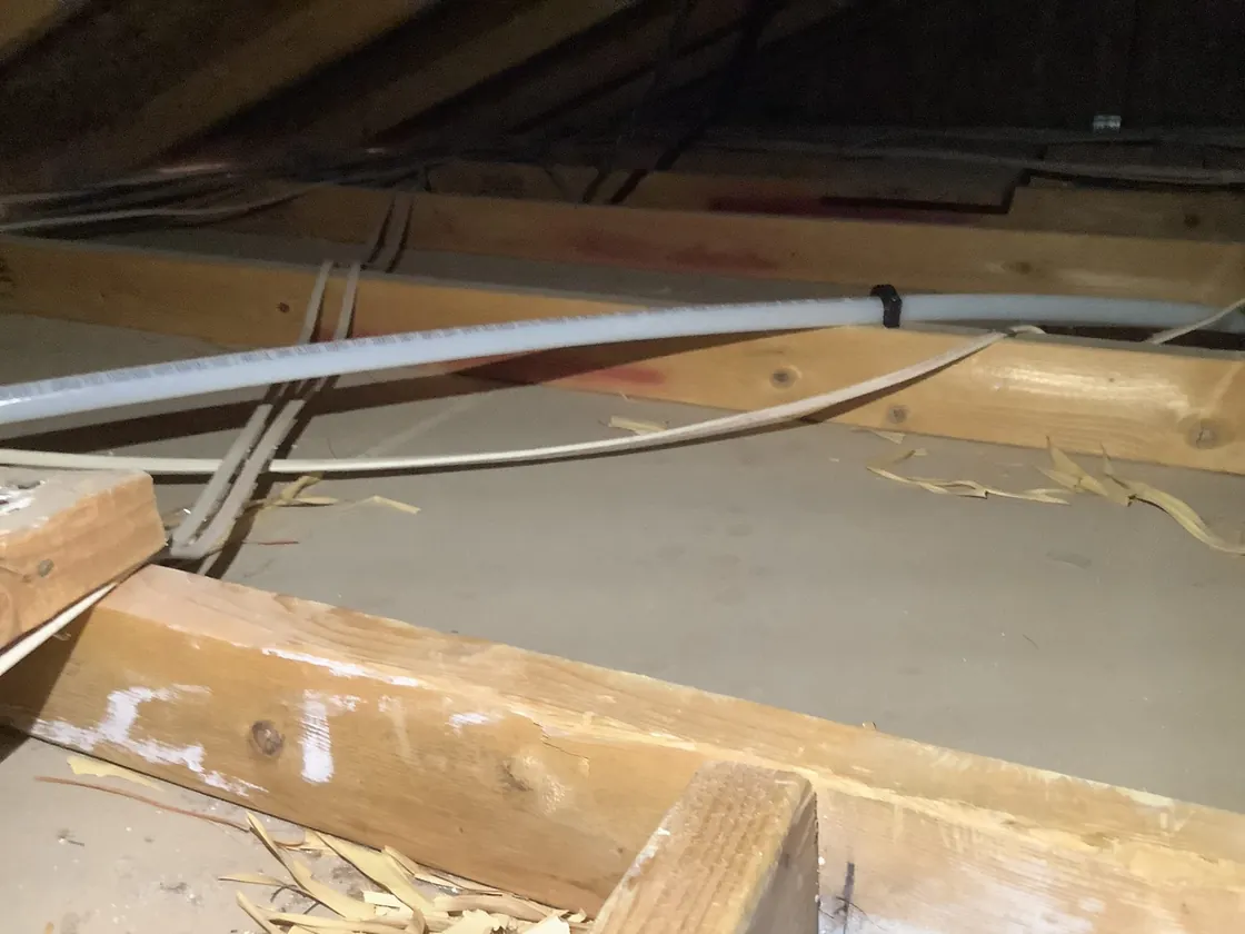 Water-supply piping routed through an attic space