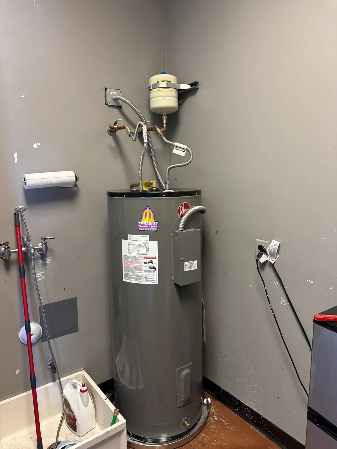 A commercial tank water heater and connected pipework