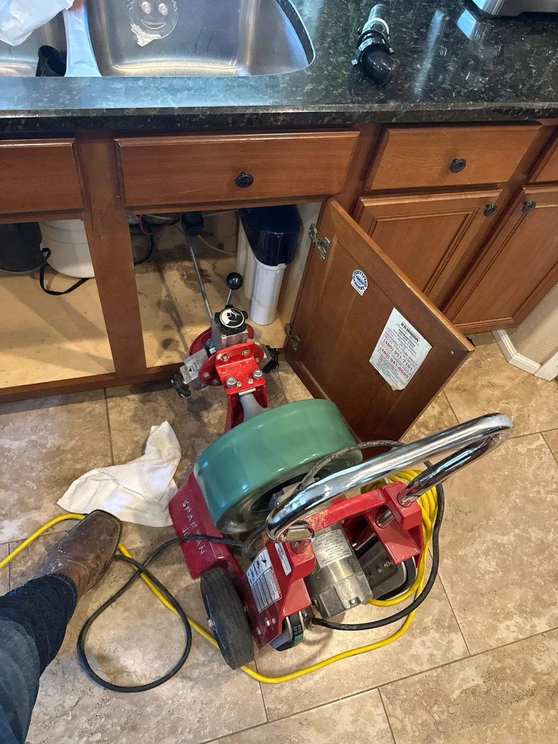 Drain cable equipment set up at a kitchen sink