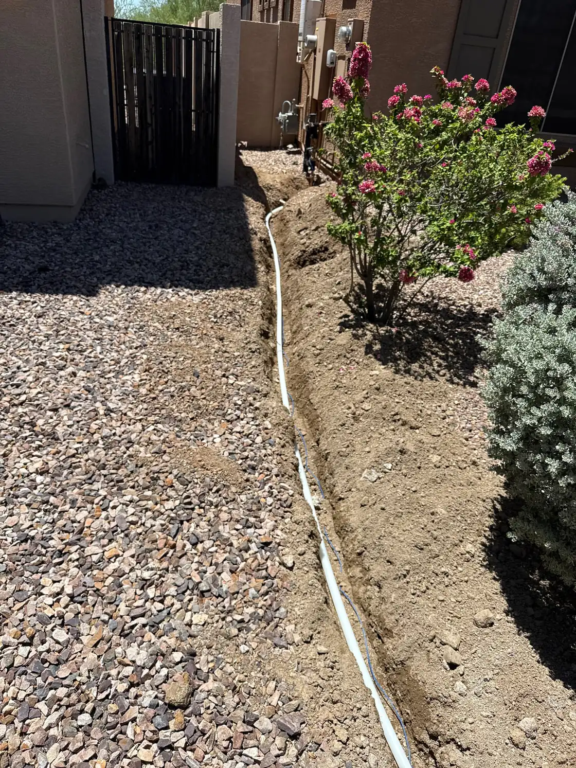 A replacement water supply pipe laid in an open trench