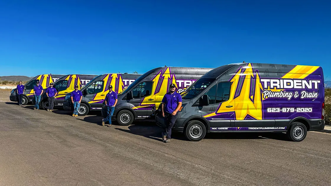 Purple and gold Trident service vans parked in a row