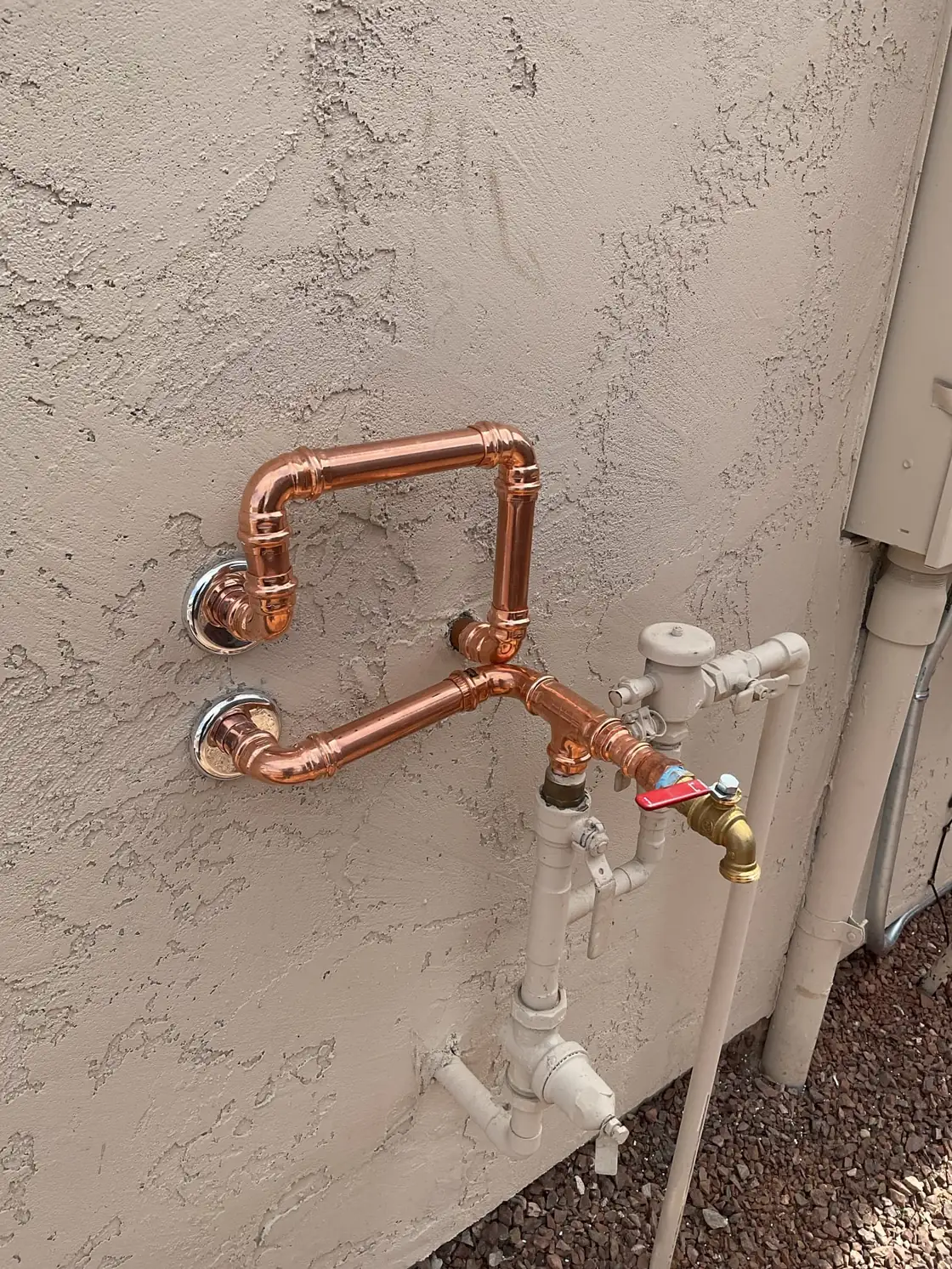 Copper plumbing connections at a water softener loop