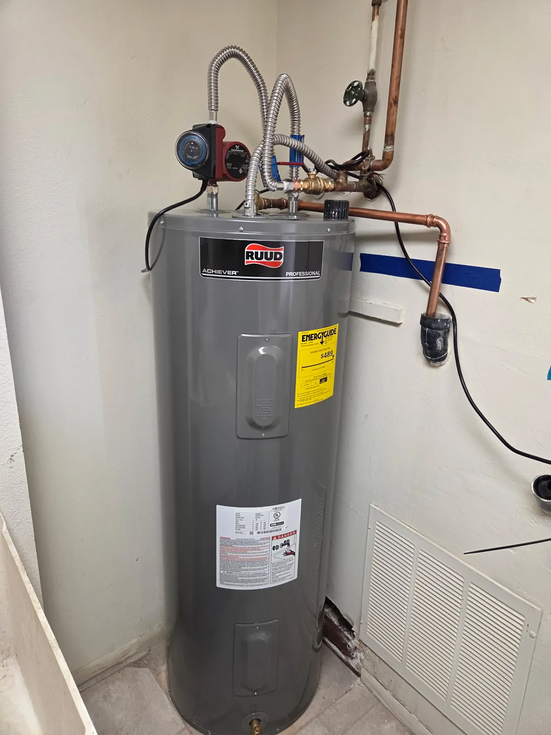 A tank water heater with connected recirculation equipment