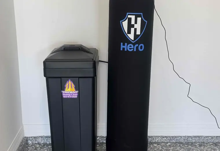 A Hero water treatment tank and salt tank installed side by side