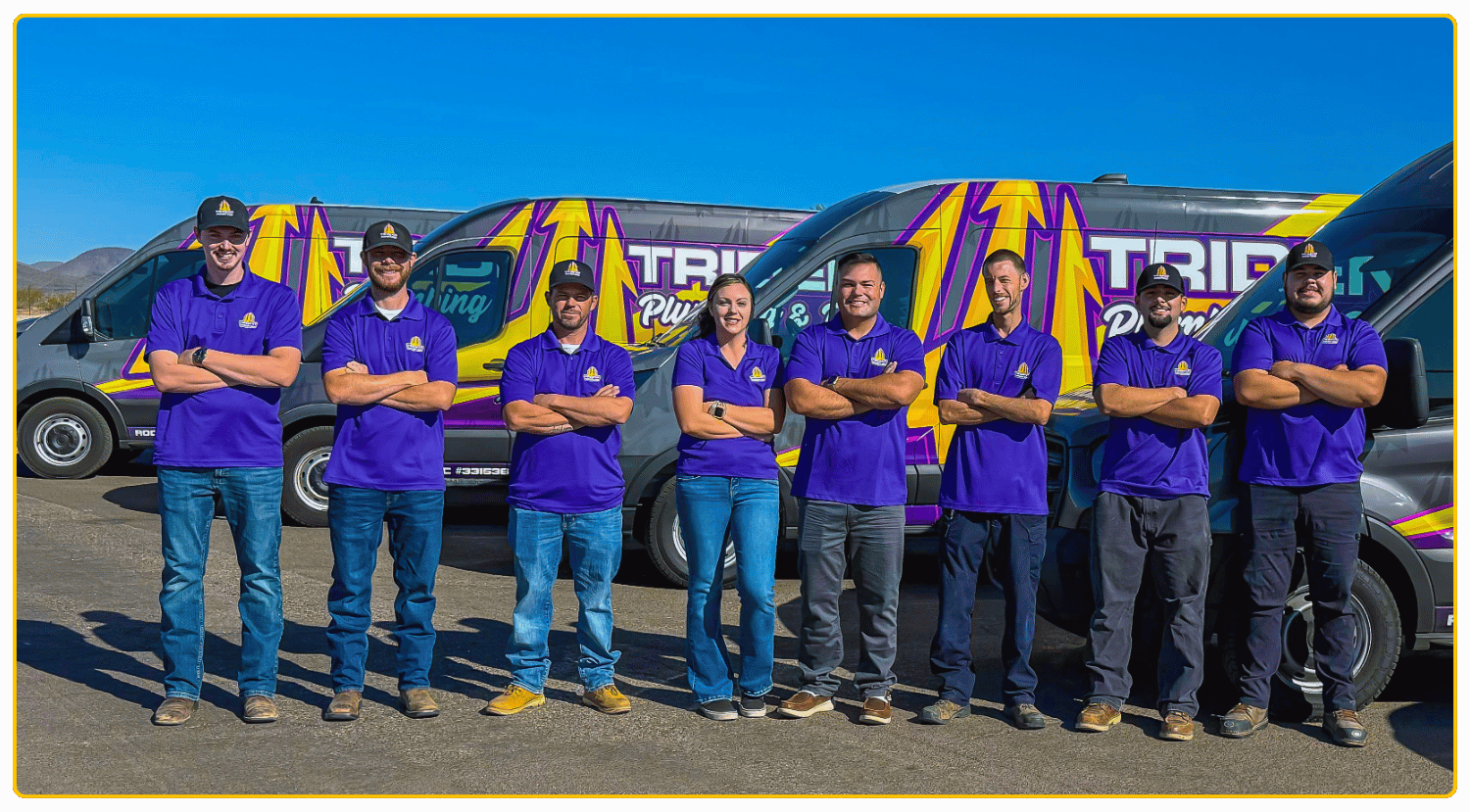 Trident Plumbing & Drain team standing in front of company service vehicles, proudly serving homeowners throughout Phoenix, AZ, with professional plumbing and water heater services.