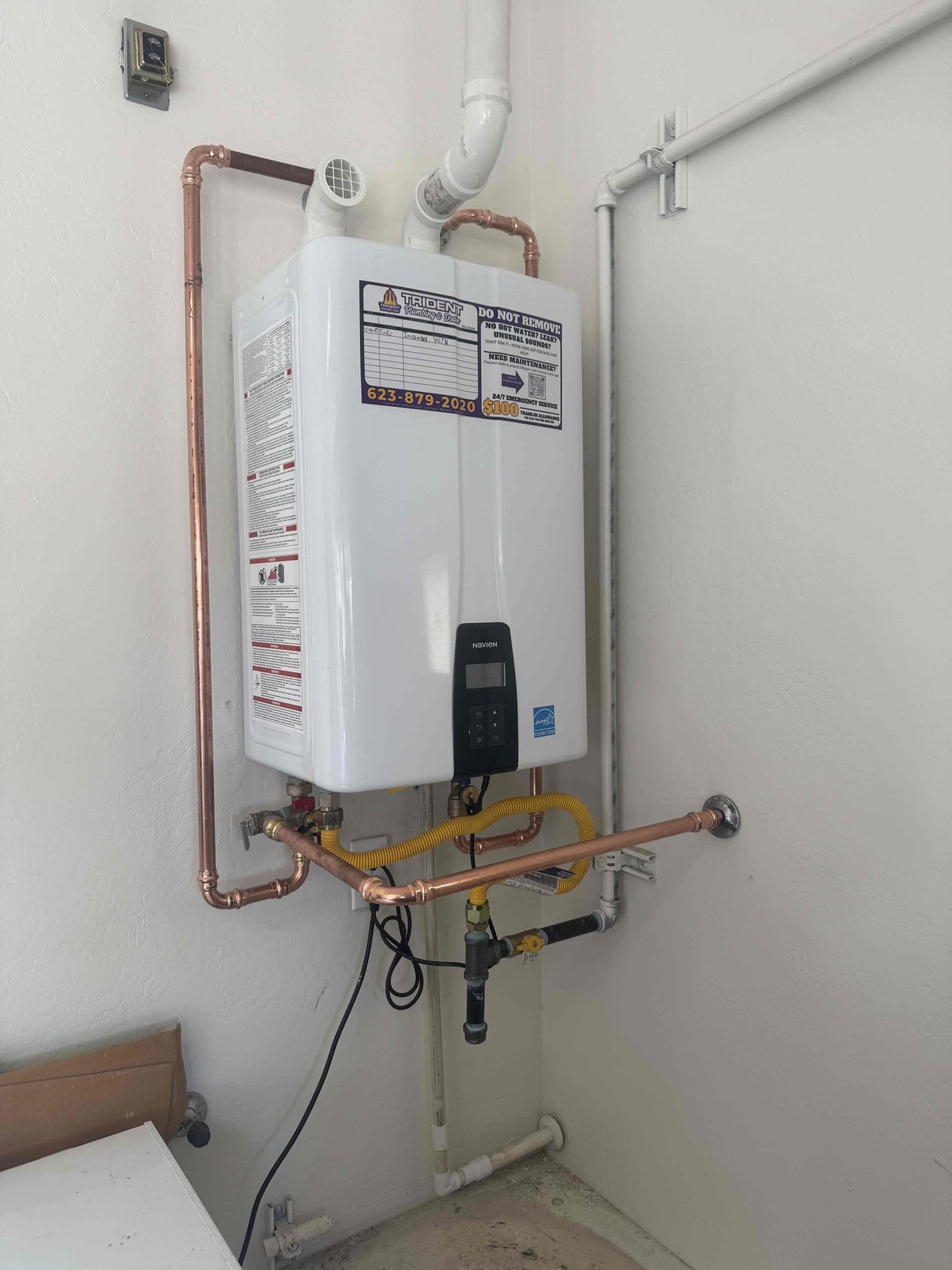 Indoor Navien tankless water heater installed in an Arizona home for energy-efficient hot water.