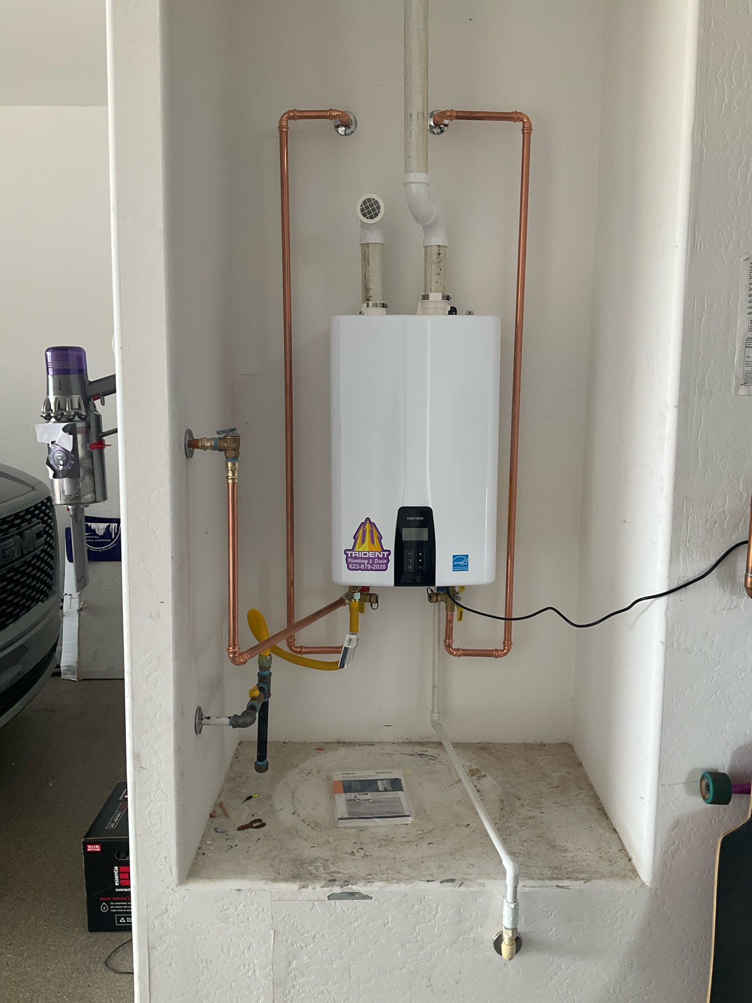 Professionally installed tankless water heater providing energy-efficient hot water for a Phoenix home.