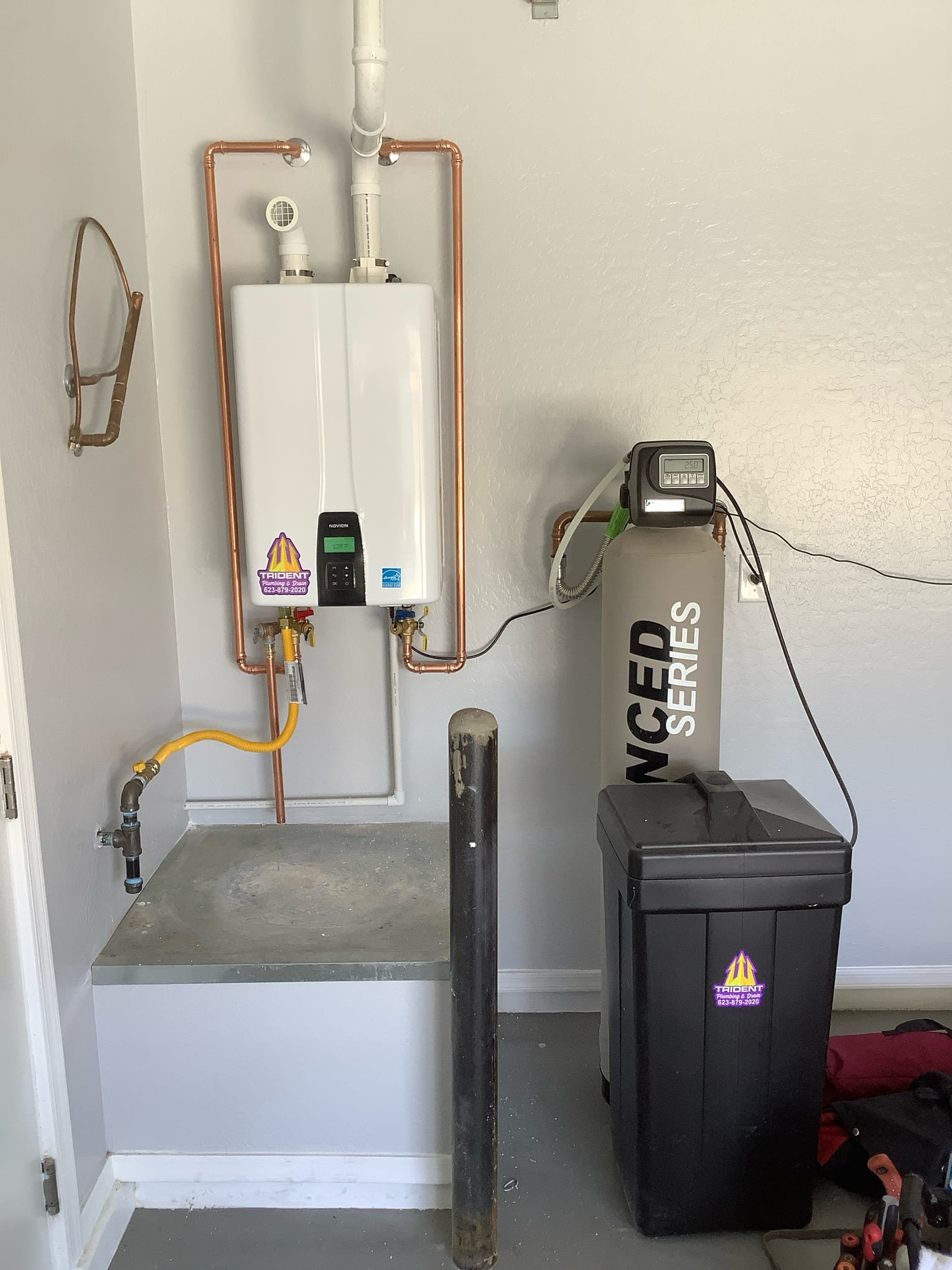 Tankless water heater installed with a whole-home water softener to reduce hard water buildup in Arizona.