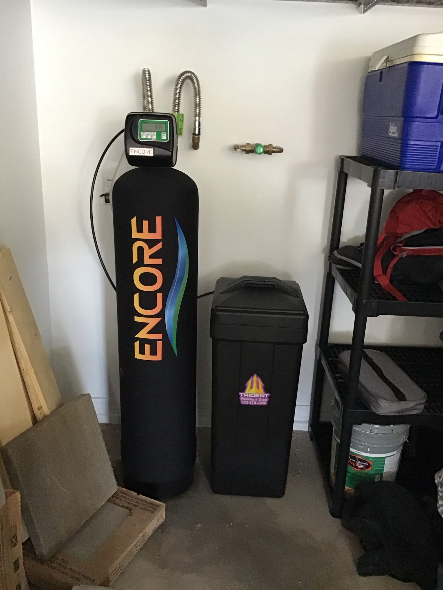 Whole-house water filtration system with water softener and carbon filters installed in an Arizona home.