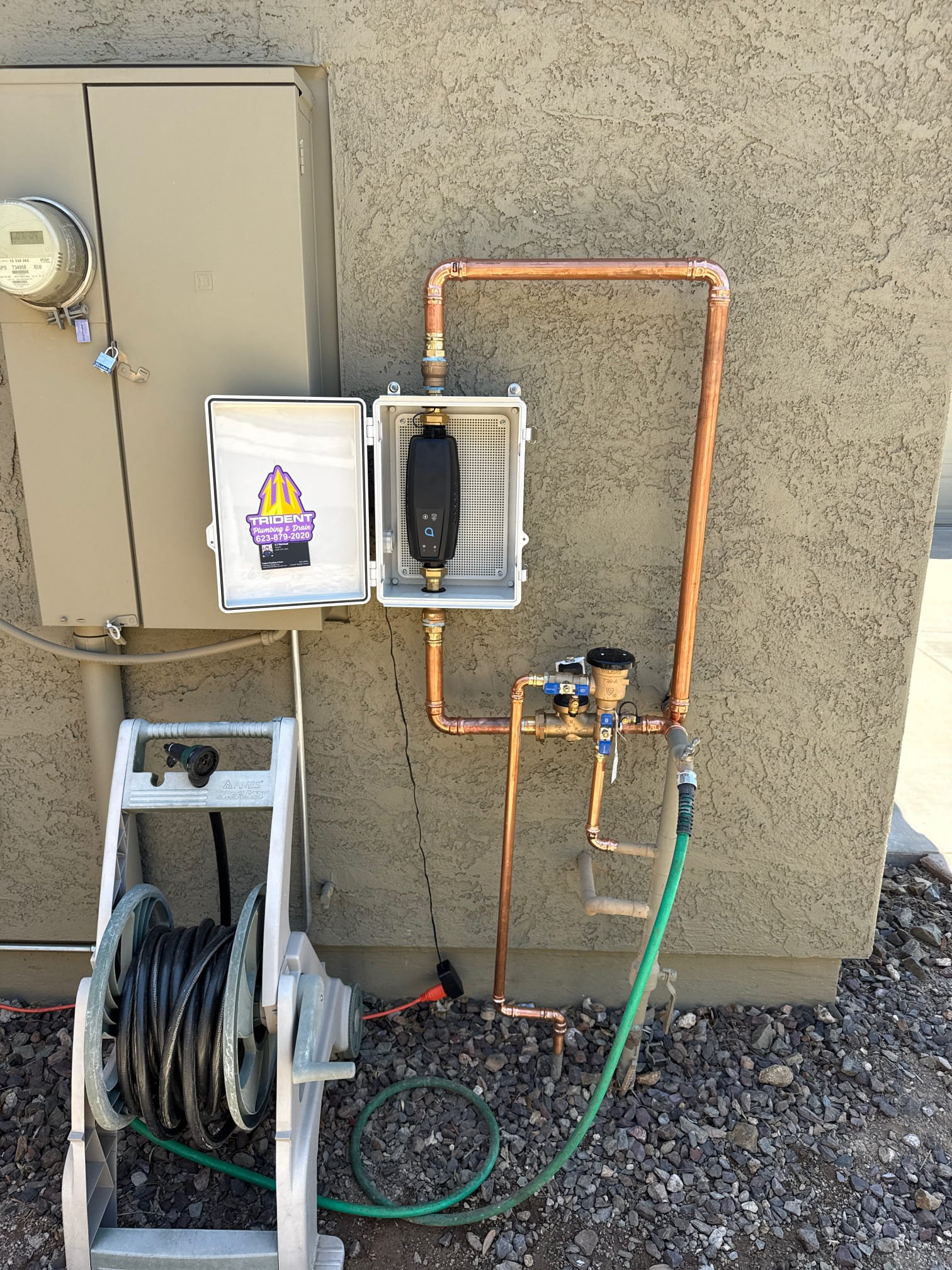 Copper pipe repair in an excavated trench after locating an underground water leak