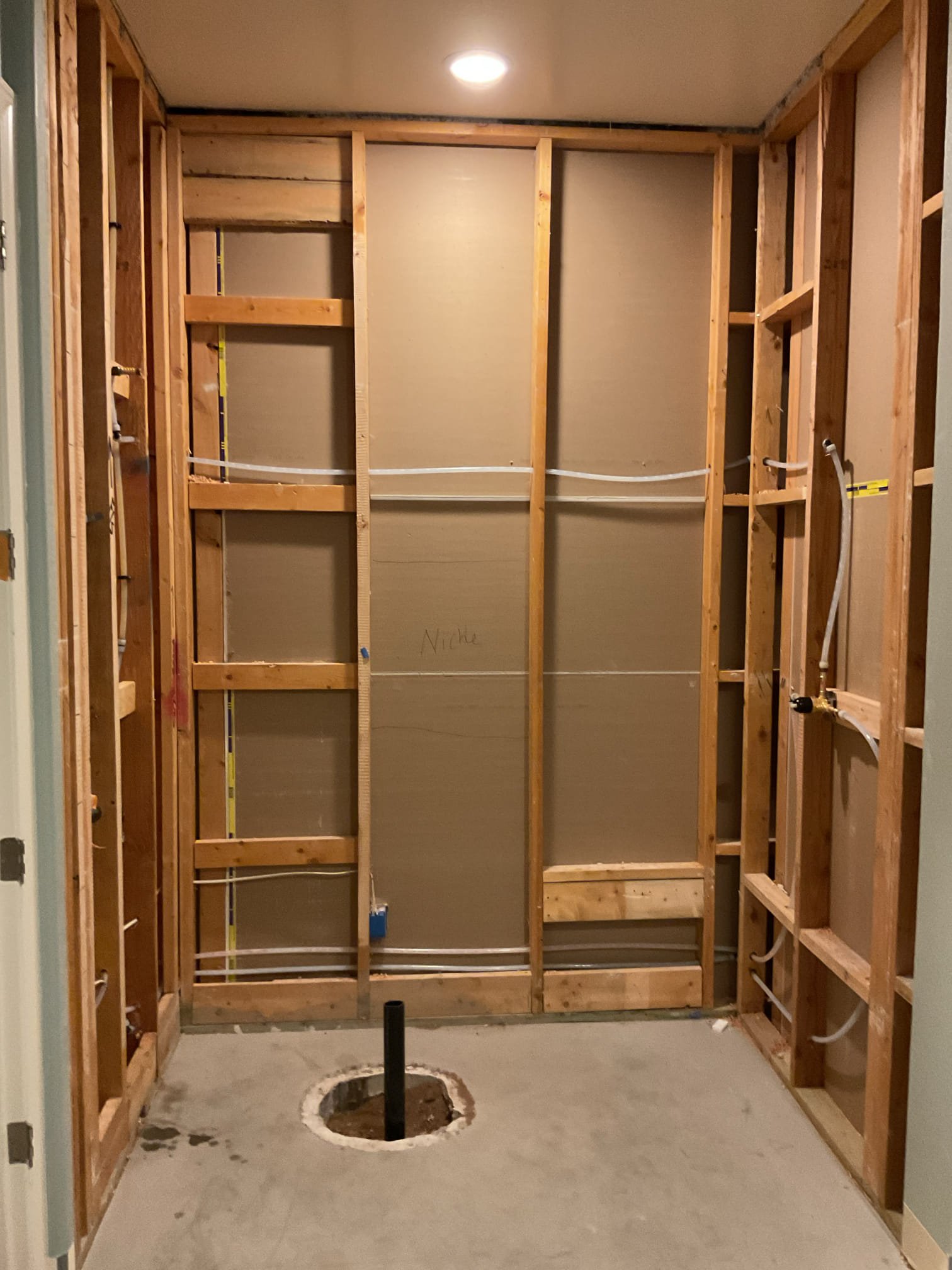 Interior plumbing reroute used to bypass a leaking water line beneath a concrete slab