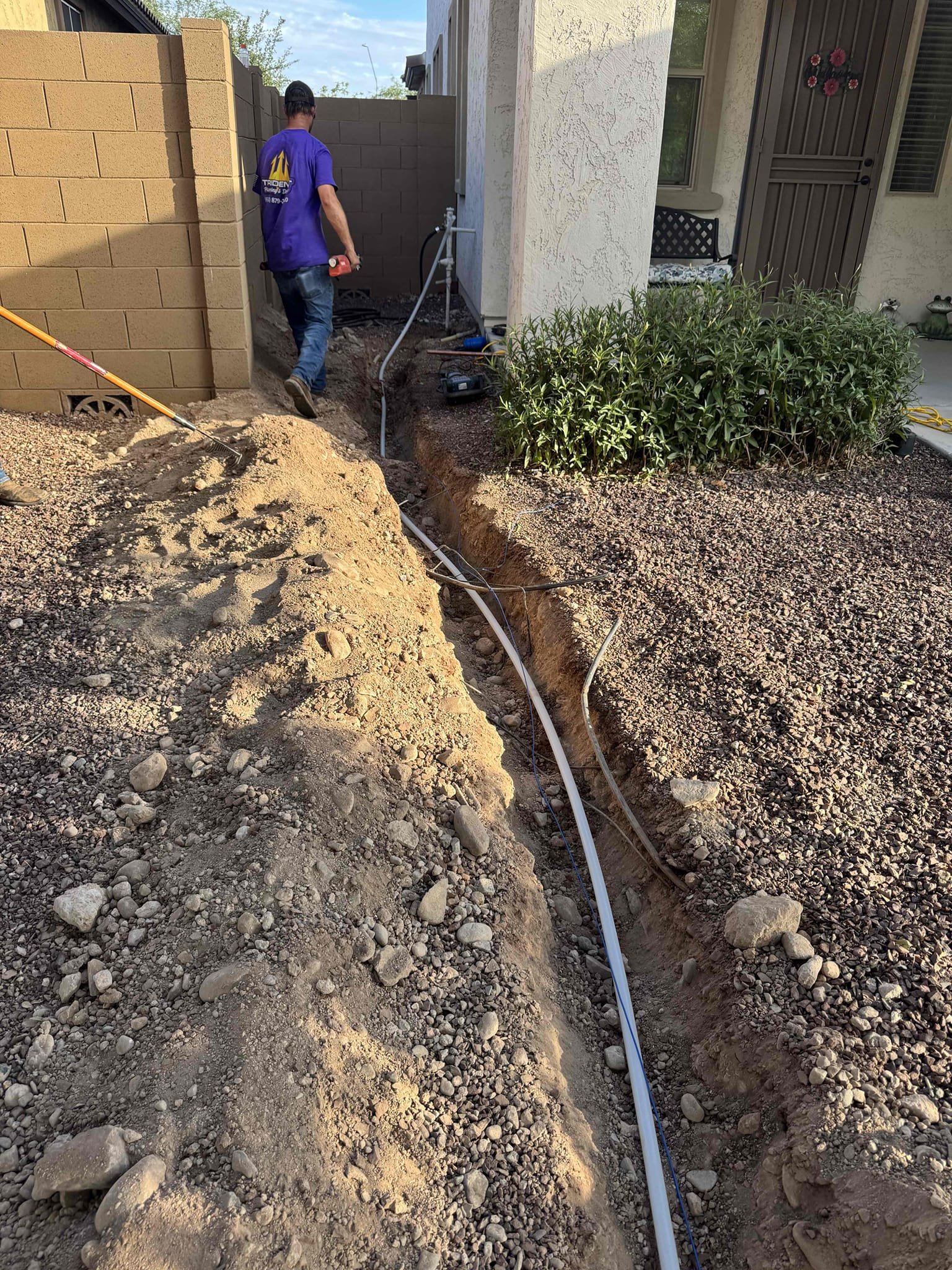 Water line reroute in an exterior trench during slab leak repair in Arizona