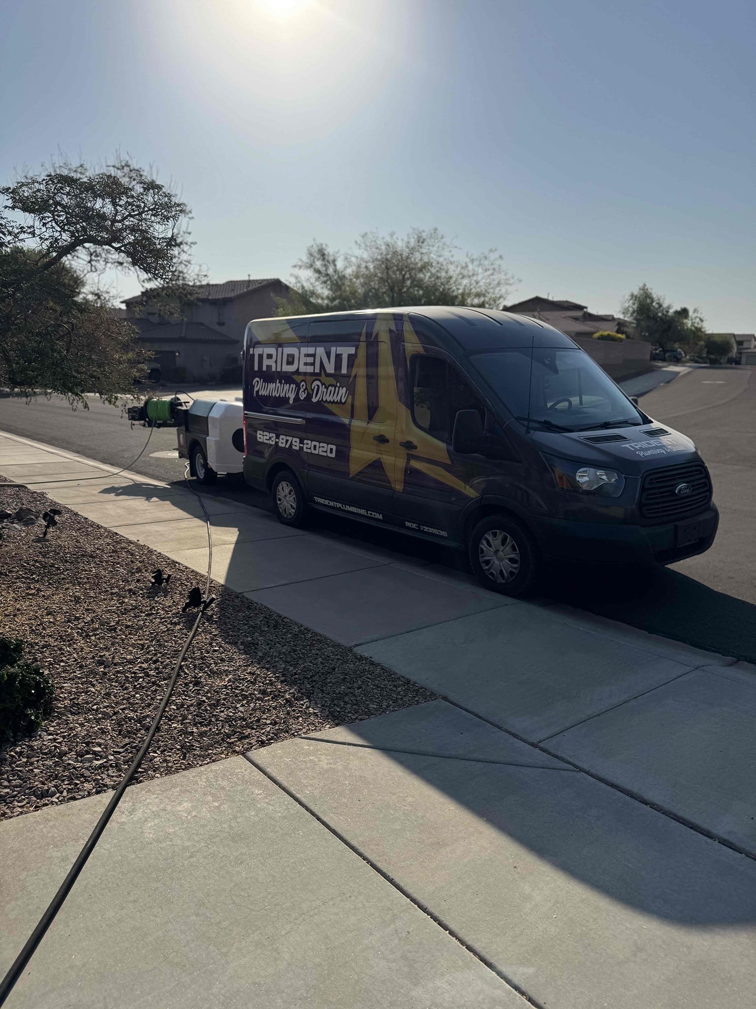 Trident Plumbing Team performing emergency plumbing services.