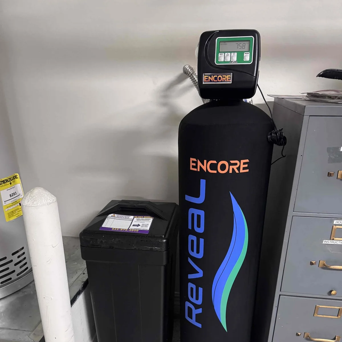 Encore Reveal whole-house water filtration system installed in an Anthem, AZ garage by Trident Plumbing & Drain.