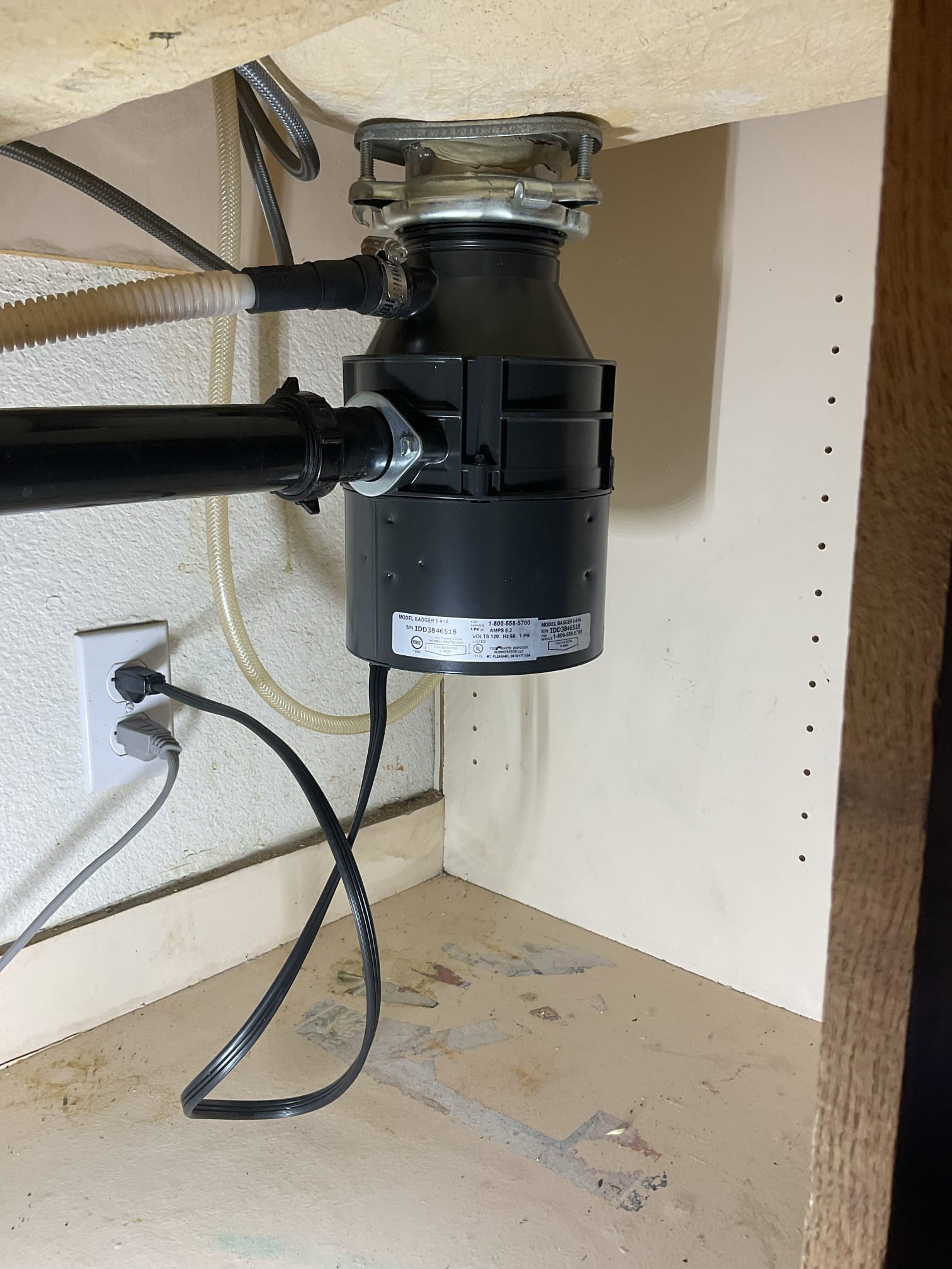 Garbage disposal connected to kitchen plumbing in a Phoenix AZ home