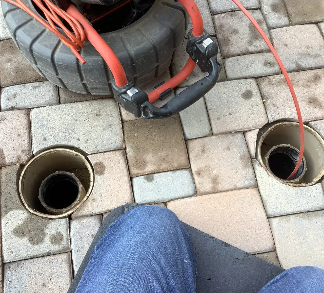 Sewer camera inspection being run through a main line cleanout in Cave Creek, AZ.