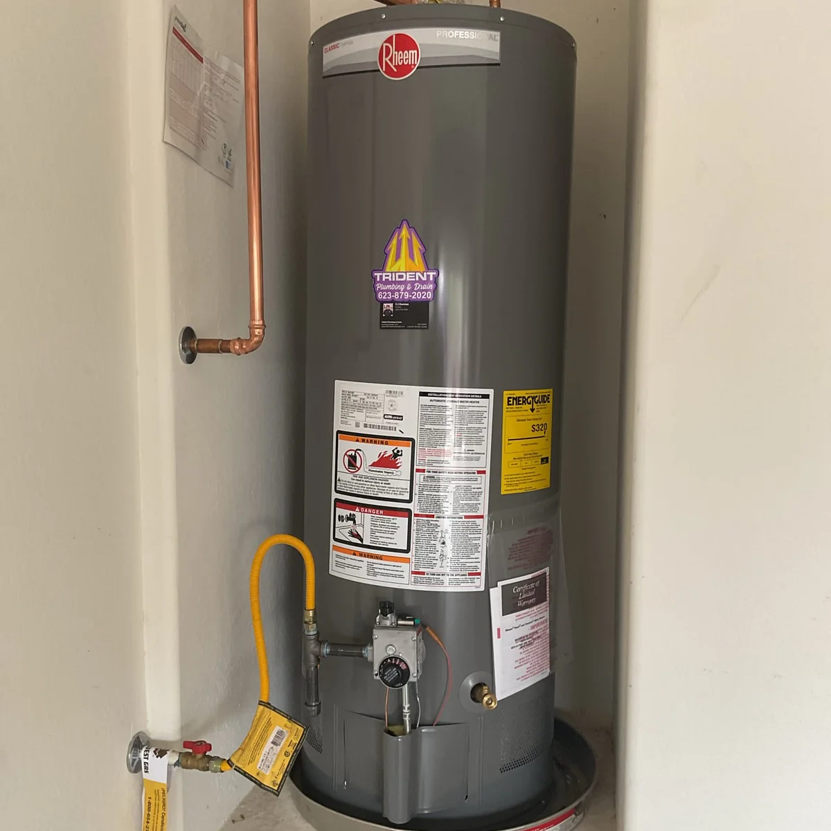 Newly installed Rheem gas water heater with expansion tank in a Sun City, AZ home.