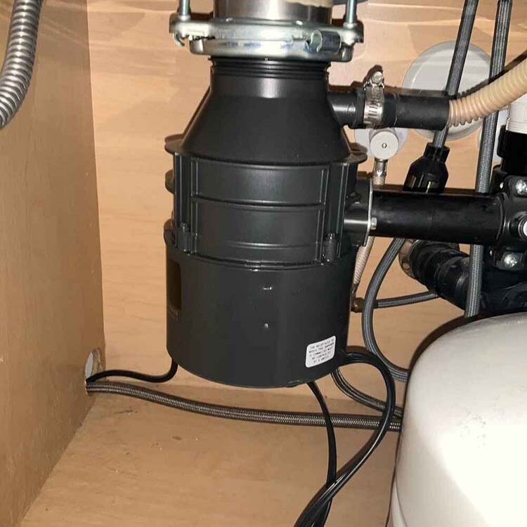 Food refuse stuck in a garbage disposal unit